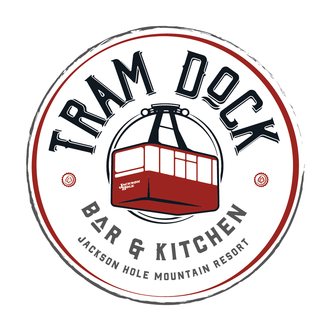 Tram Dock Bar & Kitchen badge: the name arched over a red tram cabin, with "Bar & Kitchen" and the resort's name around the base.