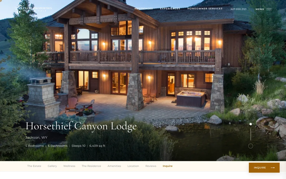 A property page: a timber lodge lit at dusk, with the section nav and inquiry button.